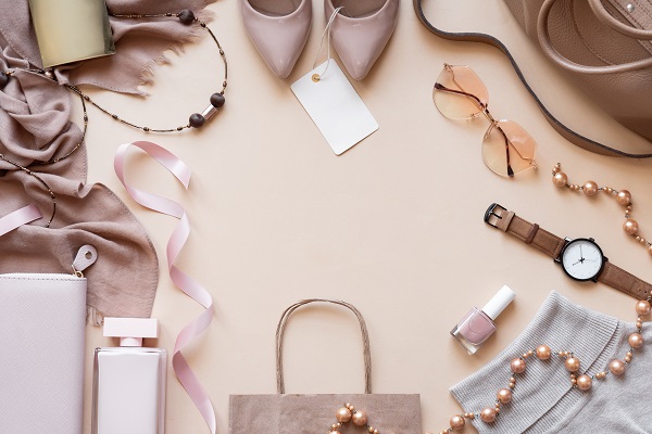 Fashion women stylish accessories outfit glamour set with label flat lay beige pastel background table with copy mock up space, female clothing offers shopping sale concept, above top view close up